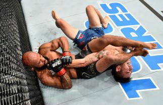 LAS VEGAS, NV - OCTOBER 07: Demetrious Johnson secures an arm bar submission against Ray Borg in their UFC flyweight championship bout during the UFC 216 event inside T-Mobile Arena on October 7, 2017 in Las Vegas, Nevada. (Photo by Jeff Bottari/Zuffa L