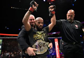 LAS VEGAS, NV - OCTOBER 07: Demetrious Johnson celebrates after his submission victory over Ray Borg in their UFC flyweight championship bout during the UFC 216 event inside T-Mobile Arena on October 7, 2017 in Las Vegas, Nevada. (Photo by Jeff Bottari/