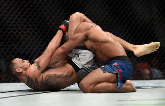 LAS VEGAS, NV - OCTOBER 07: Tony Ferguson secures a triangle choke submission to defeat Kevin Lee in their interim UFC lightweight championship bout during the UFC 216 event inside T-Mobile Arena on October 7, 2017 in Las Vegas, Nevada. (Photo by Brando