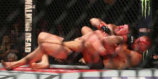 NEW YORK, NY - NOVEMBER 04: Michael Bisping of England is pinned by Georges St-Pierre of Canada in their UFC middleweight championship bout during the UFC 217 event at Madison Square Garden on November 4, 2017 in New York City. (Photo by Mike Stobe/Gett