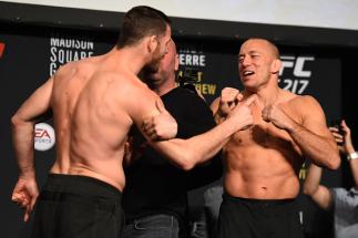 NEW YORK, NY - NOVEMBER 03: (L-R) Michael Bisping of England and Georges St-Pierre of Canada face off during the UFC 217 weigh-in inside Madison Square Garden on November 3, 2017 in New York City. (Photo by Josh Hedges/Zuffa LLC/Zuffa LLC via Getty Image