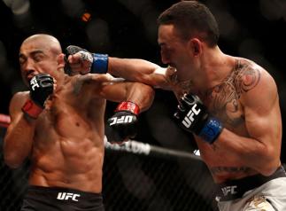 RIO DE JANEIRO, BRAZIL - JUNE 03: (R-L) Max Holloway punches Jose Aldo of Brazil in their UFC featherweight championship bout during the UFC 212 event at Jeunesse Arena on June 3, 2017 in Rio de Janeiro, Brazil. (Photo by Buda Mendes/Zuffa LLC/Zuffa LLC