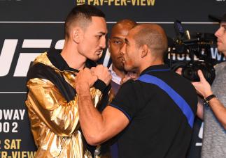DETROIT, MI - NOVEMBER 30: (L-R) Opponents Max Holloway and Jose Aldo of Brazil face off during the UFC 218 Ultimate Media Day at the DoubleTree Hotel on November 30, 2017 in Detroit, Michigan. (Photo by Josh Hedges/Zuffa LLC via Getty Images)
