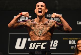 DETROIT, MI - DECEMBER 01: Max Holloway poses on the scale during the UFC 218 weigh-in inside Little Caesars Arena on December 1, 2017 in Detroit, Michigan. (Photo by Josh Hedges/Zuffa LLC/Zuffa LLC via Getty Images)