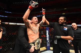 DETROIT, MI - DECEMBER 02: UFC featherweight champion Max Holloway celebrates after defeating Jose Aldo of Brazil in their UFC featherweight championship bout during the UFC 218 event inside Little Caesars Arena on December 02, 2017 in Detroit, Michigan.