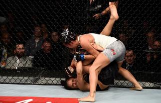 LAS VEGAS, NV - DECEMBER 30: (R-L) Carla Esparza punches Cynthia Calvillo in their women's strawweight bout during the UFC 219 event inside T-Mobile Arena on December 30, 2017 in Las Vegas, Nevada. (Photo by Jeff Bottari/Zuffa LLC)