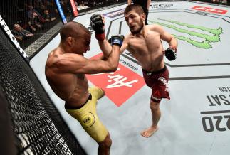 LAS VEGAS, NV - DECEMBER 30: (R-L) Khabib Nurmagomedov of Russia punches Edson Barboza of Brazil in their lightweight bout during the UFC 219 event inside T-Mobile Arena on December 30, 2017 in Las Vegas, Nevada. (Photo by Jeff Bottari/Zuffa LLC/Zuffa LL