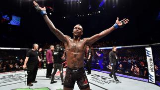 PERTH, AUSTRALIA - FEBRUARY 11: Israel Adesanya of Nigeria celebrates his victory over Rob Wilkinson of Australia in their middleweight bout during the UFC 221 event at Perth Arena on February 11, 2018 in Perth, Australia. (Photo by Jeff Bottari/Zuffa LL