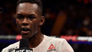 PERTH, AUSTRALIA - FEBRUARY 11: Israel Adesanya of Nigeria celebrates his victory over Rob Wilkinson of Australia in their middleweight bout during the UFC 221 event at Perth Arena on February 11, 2018 in Perth, Australia. (Photo by Jeff Bottari/Zuffa LL
