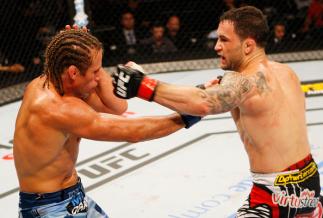 MANILA, PHILIPPINES - MAY 16: Frankie Edgar of the United States throws a punch at Uriah Faber of the United States in their featherweight fight during the UFC Fight Night event at the Mall of Asia Arena on May 16, 2015 in Manila, Philippines. (Photo by M