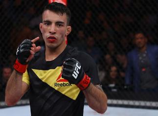 SAO PAULO, BRAZIL - NOVEMBER 19: Thomas Almeida of Brazil celebrates his victory over Alberto Morales of the United States after their bantamweight bout at the UFC Fight Night Bader v Minotouro at Ibirapuera Gymnasium on November 19, 2016 in Sao Paulo, Br