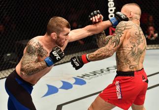BELFAST, NORTHERN IRELAND - NOVEMBER 19: (L-R) Stevie Ray of Scotland punches Ross Pearson of England in their lightweight bout during the UFC Fight Night at the SSE Arena on November 19, 2016 in Belfast, Northern Ireland. (Photo by Brandon Magnus/Zuffa