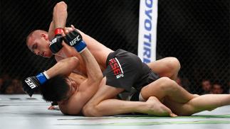 LONDON, ENGLAND - FEBRUARY 27: Tom Breese of England in action as he beats Keita Nakamura of Japan during the Welterweight Bout of the UFC Fight Night at The O2 Arena on February 27, 2016 in London, England. (Photo by Christopher Lee/Getty Images)