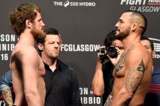 GLASGOW, SCOTLAND - JULY 15: (L-R) Gunnar Nelson of Iceland and Santiago Ponzinibbio of Argentina face off during the UFC Fight Night weigh-in at the SSE Hydro Arena Glasgow on July 15, 2017 in Glasgow, Scotland. (Photo by Josh Hedges/Zuffa LLC)