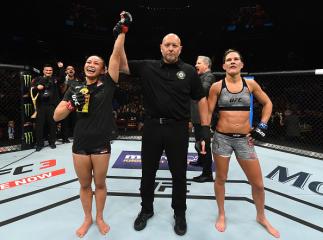 GLENDALE, AZ - APRIL 14: (L-R) Michelle Waterson celebrates her victory over Cortney Casey in their womens strawweight fight during the UFC Fight Night event at the Gila Rivera Arena on April 14, 2018 in Glendale, Arizona. (Photo by Josh Hedges/Zuffa LLC