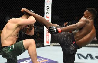 GLENDALE, AZ - APRIL 14: (R-L) Israel Adesanya of Nigeria kicks Marvin Vettori of Italy in their middleweight fight during the UFC Fight Night event at the Gila Rivera Arena on April 14, 2018 in Glendale, Arizona. (Photo by Josh Hedges/Zuffa LLC/Zuffa LL