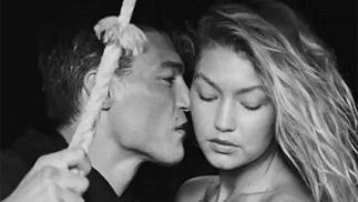 Alan Jouban kissing Gigi Hadid for Versace ad campaign