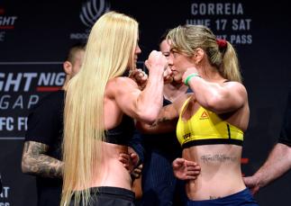 SINGAPORE - JUNE 16: (L-R) Holly Holm of the United States and Bethe Correia of Brazil face off during the UFC Fight Night weigh-in at the Marina Bay Sands on June 16, 2017 in Singapore. (Photo by Brandon Magnus/Zuffa LLC/Zuffa LLC via Getty Images)