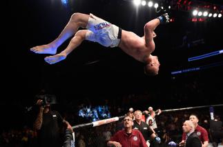 Justin Gaethje celebrates by doing a backflip off the Octagon after defeating Michael Johnson in their lightweight bout during The Ultimate Fighter Finale in 2017