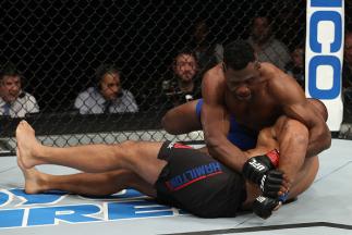 ALBANY, NY - DECEMBER 09: (R-L) Francis Ngannou of Cameroon secures a kimura submission against Anthony Hamilton in their heavyweight bout during the UFC Fight Night event at the Times Union Center on December 9, 2016 in Albany, New York. (Photo by Patri