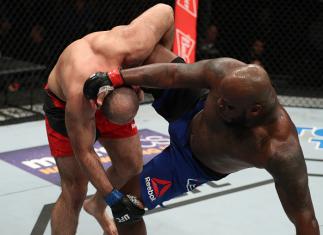 ALBANY, NY - DECEMBER 09:  (R-L) Shamil Abdurakhimov of Russia takes down Derrick Lewis in their heavyweight bout during the UFC Fight Night event at the Times Union Center on December 9, 2016 in Albany, New York. (Photo by Patrick Smith/Zuffa LLC/Zuffa L