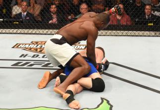 AUCKLAND, NEW ZEALAND - JUNE 11: (L-R) Derek Brunson punches Daniel Kelly of Australia in their middleweight fight during the UFC Fight Night event at the Spark Arena on June 11, 2017 in Auckland, New Zealand. (Photo by Josh Hedges/Zuffa LLC/Zuffa LLC vi