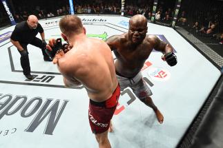 AUSTIN, TX - FEBRUARY 18: Derrick Lewis (R) punches Marcin Tybura of Poland in their heavyweight bout during the UFC Fight Night event at Frank Erwin Center on February 18, 2018 in Austin, Texas. (Photo by Josh Hedges/Zuffa LLC/Zuffa LLC via Getty Image