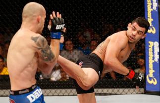 BARUERI, BRAZIL - DECEMBER 20: (R-L) Renan Barao of Brazil kicks Mitch Gagnon of Canada in their bantamweight fight during the UFC Fight Night event inside the Ginasio Jose Correa on December 20, 2014 in Barueri, Brazil. (Photo by Josh Hedges/Zuffa LLC/Z