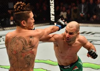 BELFAST, NORTHERN IRELAND - NOVEMBER 19: (R-L) Artem Lobov of Russia punches Teruto Ishihara of Japan in their featherweight bout during the UFC Fight Night at the SSE Arena on November 19, 2016 in Belfast, Northern Ireland. (Photo by Brandon Magnus/Zuff