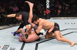 BOSTON, MA - JANUARY 17: The referee stops the bout as Patrick Cote (R) of Canada defeats Ben Saunders (L) in their welterweight bout during the UFC Fight Night event inside TD Garden on January 17, 2016 in Boston, Massachusetts. (Photo by Jeff Bottari/Z