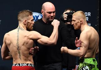 BOSTON, MA - JANUARY 17: UFC featherweights Conor 'The Notorious' McGregor of Ireland (L) faces off with opponent Dennis Siver of Germany during the UFC Fight Night Boston weigh-in event at the Orpheum Theatre on January 17, 2015 in Boston, Massachusetts