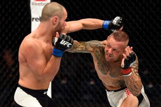 BRISBANE, AUSTRALIA - MARCH 20: (R-L) Ross Pearson of England punches Chad Laprise of Canada in their lightweight bout during the UFC Fight Night event at the Brisbane Entertainment Centre on March 20, 2016 in Brisbane, Australia. (Photo by Josh Hedges/