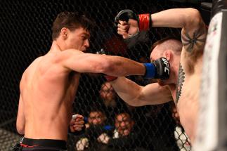 BRISBANE, AUSTRALIA - MARCH 20: (L-R) Alan Jouban of the United States punches Brendan O'Reilly of Australia in their welterweight bout during the UFC Fight Night event at the Brisbane Entertainment Centre on March 20, 2016 in Brisbane, Australia. (Photo