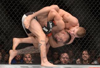 BRISBANE, AUSTRALIA - MARCH 20: Jake Matthews gets Johnny Case in a grapple hold during their UFC Lightweight Bout at UFC Brisbane on March 20, 2016 in Brisbane, Australia. (Photo by Bradley Kanaris/Getty Images)