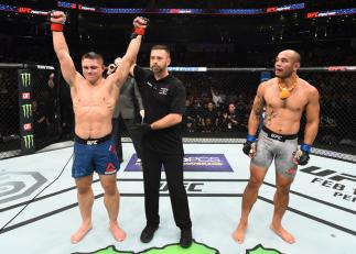 CHARLOTTE, NC - JANUARY 27: (L-R) Drew Dober celebrates his victory over Frank Camacho of Guam in their lightweight bout during a UFC Fight Night event at Spectrum Center on January 27, 2018 in Charlotte, North Carolina. (Photo by Josh Hedges/Zuffa LLC/