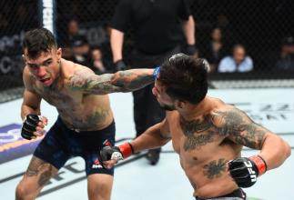 CHARLOTTE, NC - JANUARY 27: (L-R) Andre Fili punches Dennis Bermudez in their featherweight bout during a UFC Fight Night event at Spectrum Center on January 27, 2018 in Charlotte, North Carolina. (Photo by Josh Hedges/Zuffa LLC/Zuffa LLC via Getty Imag