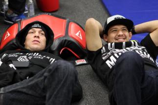 SEATTLE, WA - DECEMBER 08: Nate Diaz (L) relaxes in his locker room with teammate Gilbert Melendez before his bout against Benson Henderson at the UFC on FOX event on December 8, 2012 at Key Arena in Seattle, Washington. (Photo by Mike Roach/Zuffa LLC/