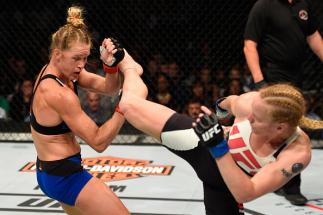 CHICAGO, IL - JULY 23: (R-L) Valentina Shevchenko of Kyrgyzstan kicks Holly Holm in their women's bantamweight bout during the UFC Fight Night event at the United Center on July 23, 2016 in Chicago, Illinois. (Photo by Josh Hedges/Zuffa LLC/Zuffa LLC via