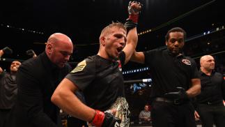 CHICAGO, IL - JULY 25: TJ Dillashaw celebrates after his TKO victory over Renan Barao of Brazil UFC bantamweight championship bout during the UFC event at the United Center on July 25, 2015 in Chicago, Illinois. (Photo by Jeff Bottari/Zuffa LLC/Zuffa LL