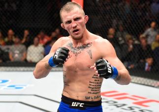 DENVER, CO - JANUARY 28: Jason Knight attempts to celebrates his submission victory over Alex Caceres in their featherweight bout during the UFC Fight Night event at the Pepsi Center on January 28, 2017 in Denver, Colorado. (Photo by Josh Hedges/Zuffa LL