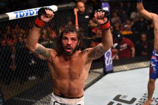 FAIRFAX, VA - APRIL 04: Clay Guida celebrates after defeating Robbie Peralta in their featherweight fight during the UFC Fight Night event at the Patriot Center on April 4, 2015 in Fairfax, Virginia. (Photo by Josh Hedges/Zuffa LLC/Zuffa LLC via Getty I
