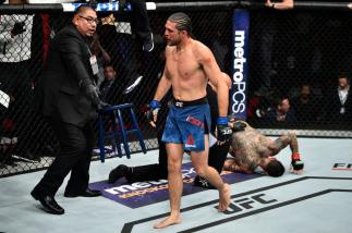 FRESNO, CA - DECEMBER 09: (L-R) Brian Ortega celebrates his submission victory over Cub Swanson in their featherweight bout during the UFC Fight Night event inside Save Mart Center on December 9, 2017 in Fresno, California. (Photo by Jeff Bottari/Zuffa L