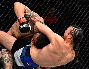 FRESNO, CA - DECEMBER 09:  (R-L) Brian Ortega attempts to submit Cub Swanson in their featherweight bout during the UFC Fight Night event inside Save Mart Center on December 9, 2017 in Fresno, California. (Photo by Jeff Bottari/Zuffa LLC/Zuffa LLC via Get