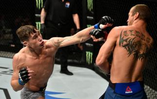 GDANSK, POLAND - OCTOBER 21: (L-R) Darren Till of England punches Donald Cerrone in their welterweight bout during the UFC Fight Night event inside Ergo Arena on October 21, 2017 in Gdansk, Poland. (Photo by Jeff Bottari/Zuffa LLC/Zuffa LLC via Getty Ima