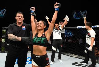 GLASGOW, SCOTLAND - JULY 16: Cynthia Calvillo celebrates her victory over Joanne Calderwood of Scotland in their women's strawweight bout during the UFC Fight Night event at the SSE Hydro Arena Glasgow on July 16, 2017 in Glasgow, Scotland. (Photo by Jos