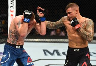 GLENDALE, AZ - APRIL 14: (R-L) Dustin Poirier punches Justin Gaethje in their lightweight fight during the UFC Fight Night event at the Gila Rivera Arena on April 14, 2018 in Glendale, Arizona. (Photo by Josh Hedges/Zuffa LLC/Zuffa LLC via Getty Images)