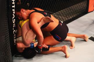 HAMBURG, GERMANY - SEPTEMBER 03: Ashlee Evans-Smith (top) of the USA controls the body of Veronica Macedo (L) of Venezuela in their Womens Bantamweight Bout during the UFC Fight Night held at Barclaycard Arena on September 3, 2016 in Hamburg, Germany.