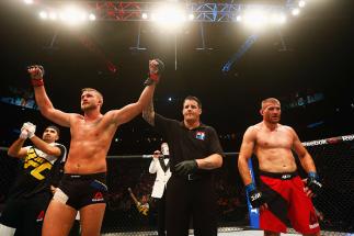 HAMBURG, GERMANY - SEPTEMBER 03: Alexander Gustafsson (L) of Sweden celebrates his victory over Jan Blachowicz (R) of Poland in their Light Heavyweight Bout during the UFC Fight Night held at Barclaycard Arena on September 3, 2016 in Hamburg, Germany. (