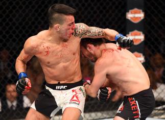 LAS VEGAS, NV - JULY 11: (L-R) Thomas Almeida elbows Brad Pickett in their bantamweight fight during the UFC 189 event inside MGM Grand Garden Arena on July 11, 2015 in Las Vegas, Nevada. (Photo by Josh Hedges/Zuffa LLC/Zuffa LLC via Getty Images)