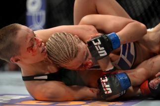 LAS VEGAS, NEVADA - DECEMBER 10: (L) Rose Namajunas attempts a submission on Paige VanZant in their women's strawweight bout during the UFC Fight Night event at The Chelsea at the Cosmopolitan of Las Vegas on December 10, 2015 in Las Vegas, Nevada. (Pho